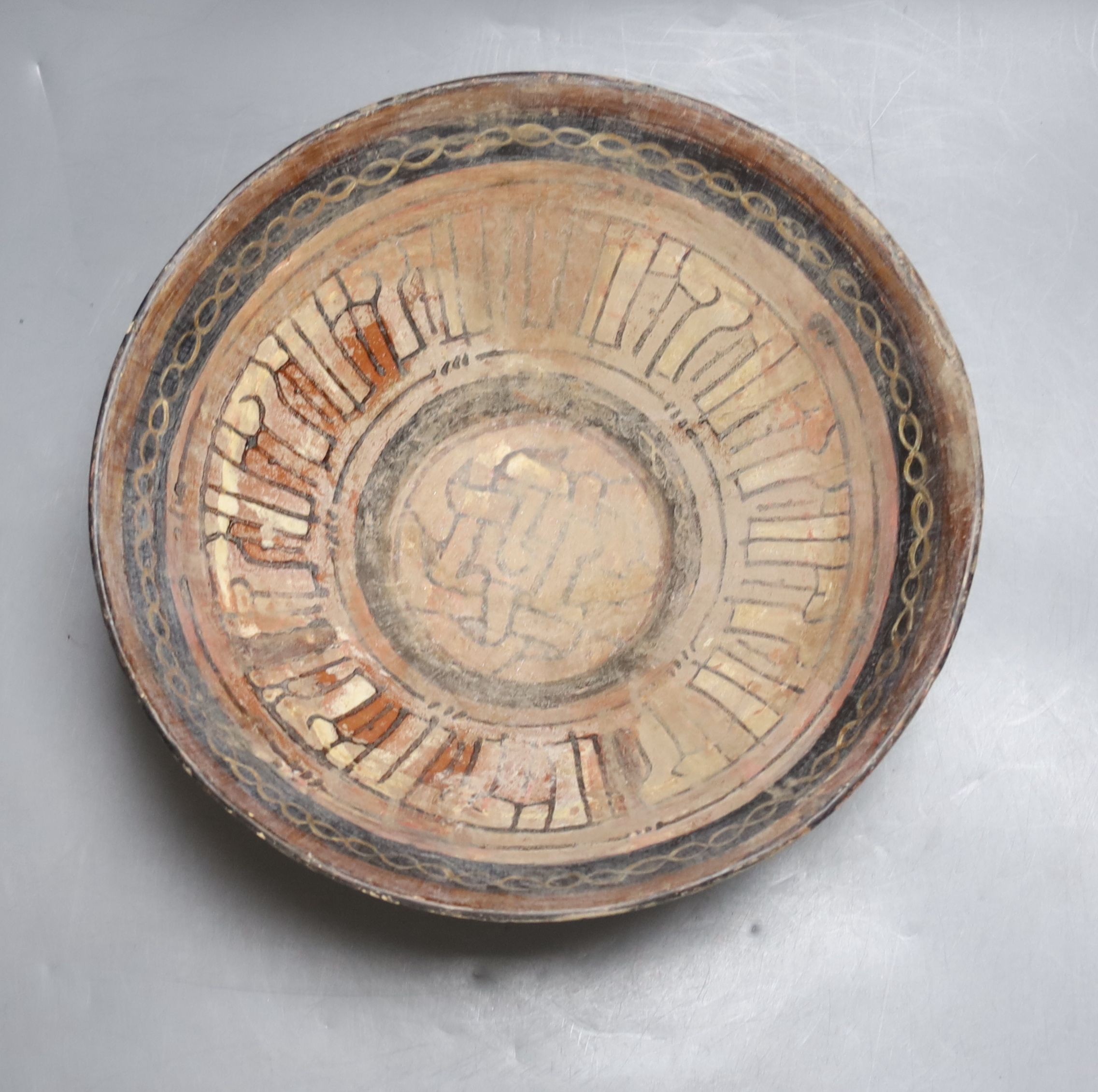 An Islamic bowl with kufic script, diameter 24cm